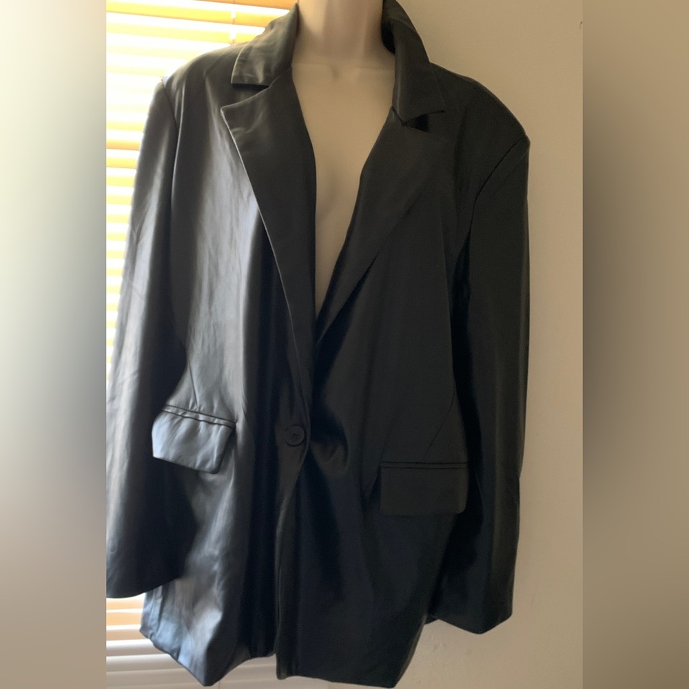 Leather blazer xl. Very soft. Xl excellent fit. Vegan leather.